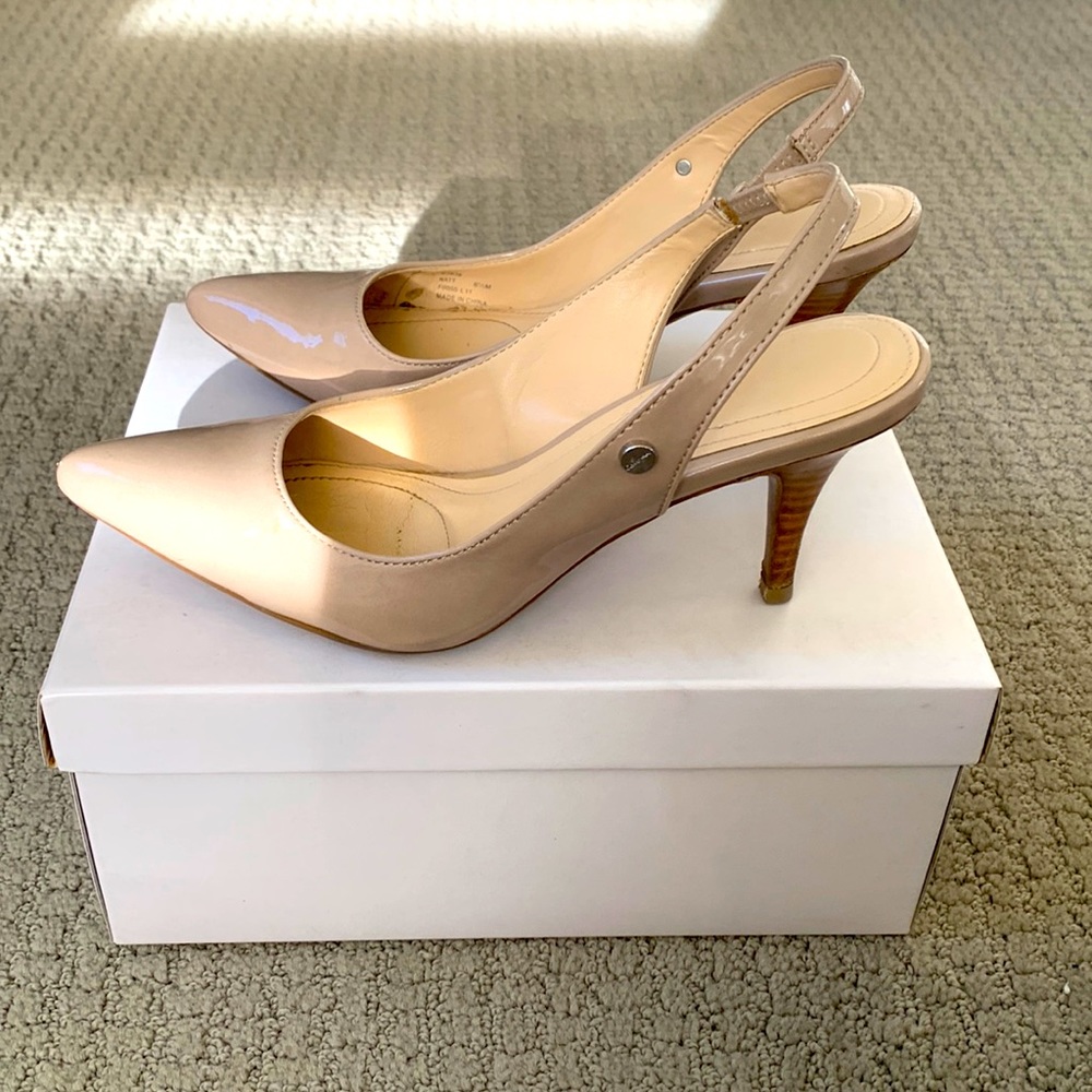Nude patent leather Calvin Klein kitten heels.